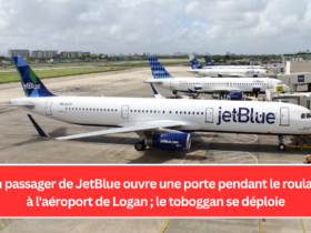 Un passager de JetBlue ouvre une porte pendant le roulage à l'aéroport de Logan ; le toboggan se déploie